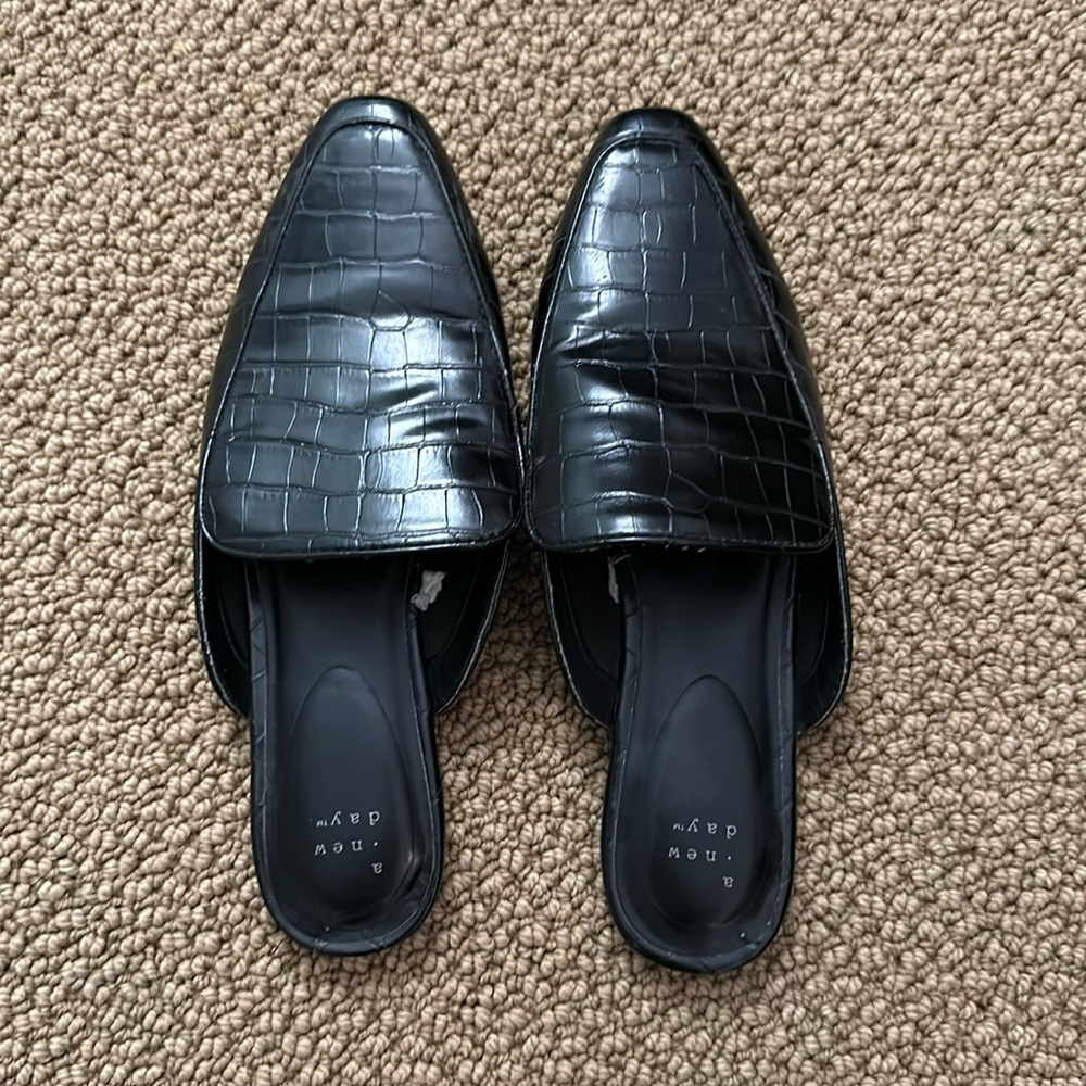 A new day gently used size 9 black slides